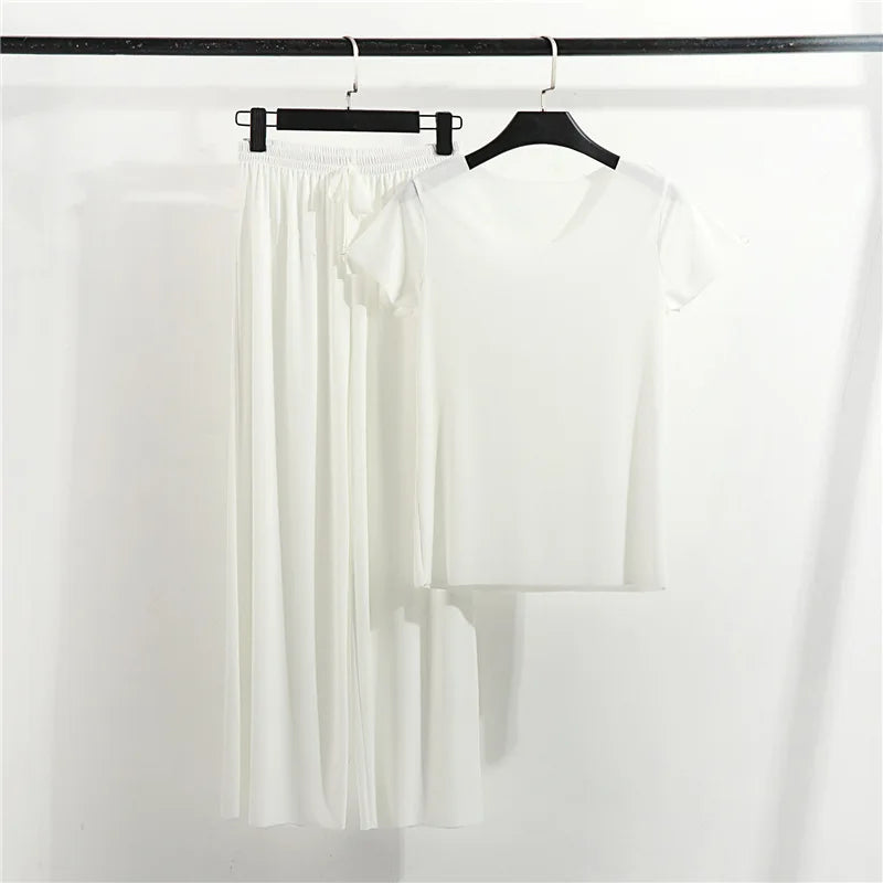 White short sleeve pajama set with relaxed fit tee and wide leg pants on hangers