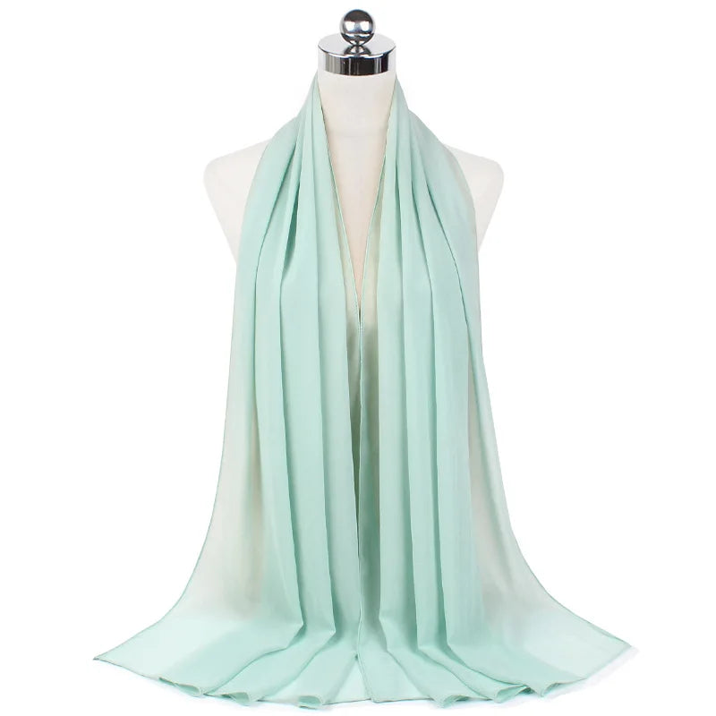 Soft mint green lightweight scarf draped on mannequin, cozy loungewear accessory