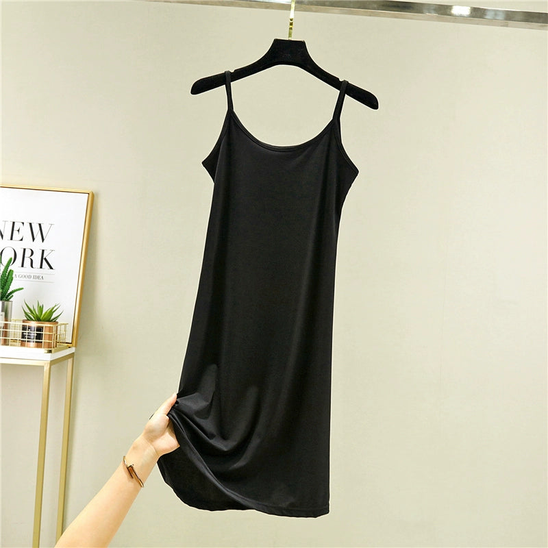 Black sleeveless loungewear slip dress with spaghetti straps on hanger, minimalist style