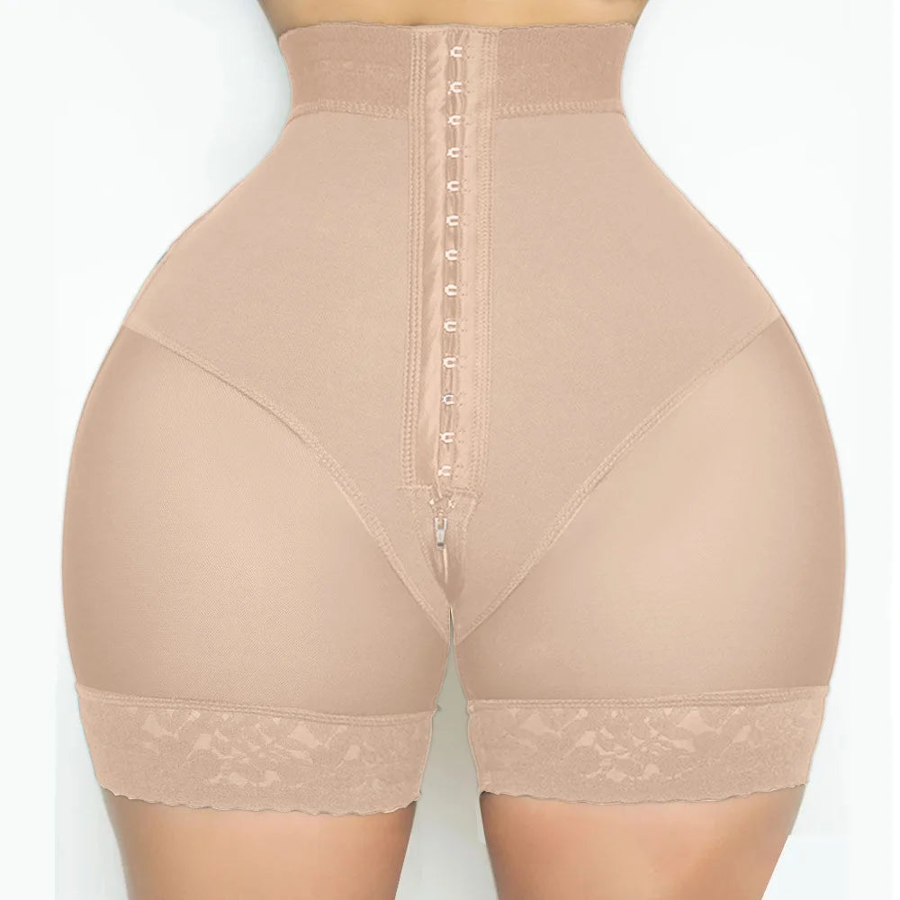 High-waisted nude shapewear shorts with lace trim, front hooks, and zipper detail