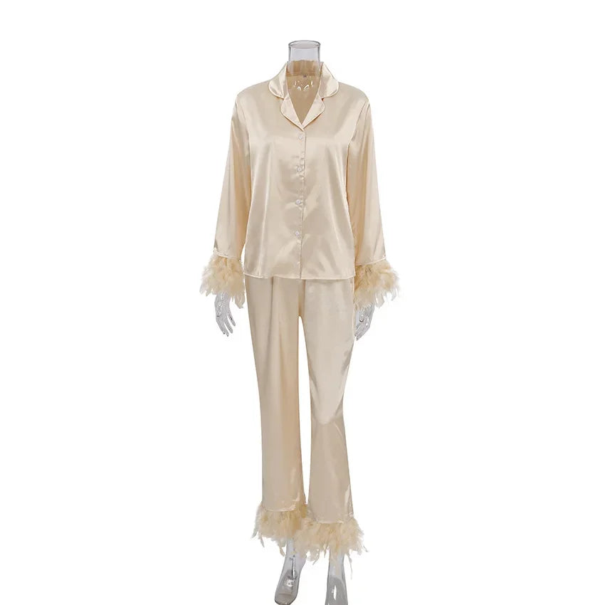Satin feather-trim pajama set in cream on mannequin, showing loungewear concierge tiers.