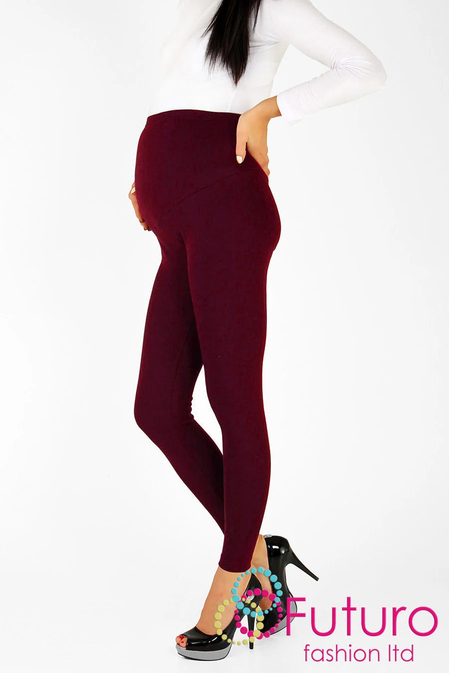 Burgundy maternity leggings with over-bump waistband, paired with white top and heels for cozy comfort