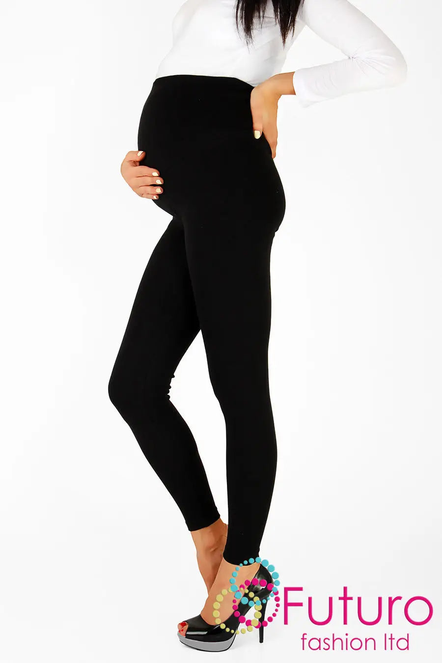 Black maternity leggings with over-bump waistband, styled with white top and heels for cozy comfort