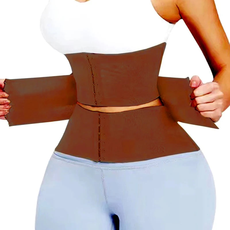 Woman wearing brown waist trainer belt over white top and light blue leggings, showing tiered wrap design.