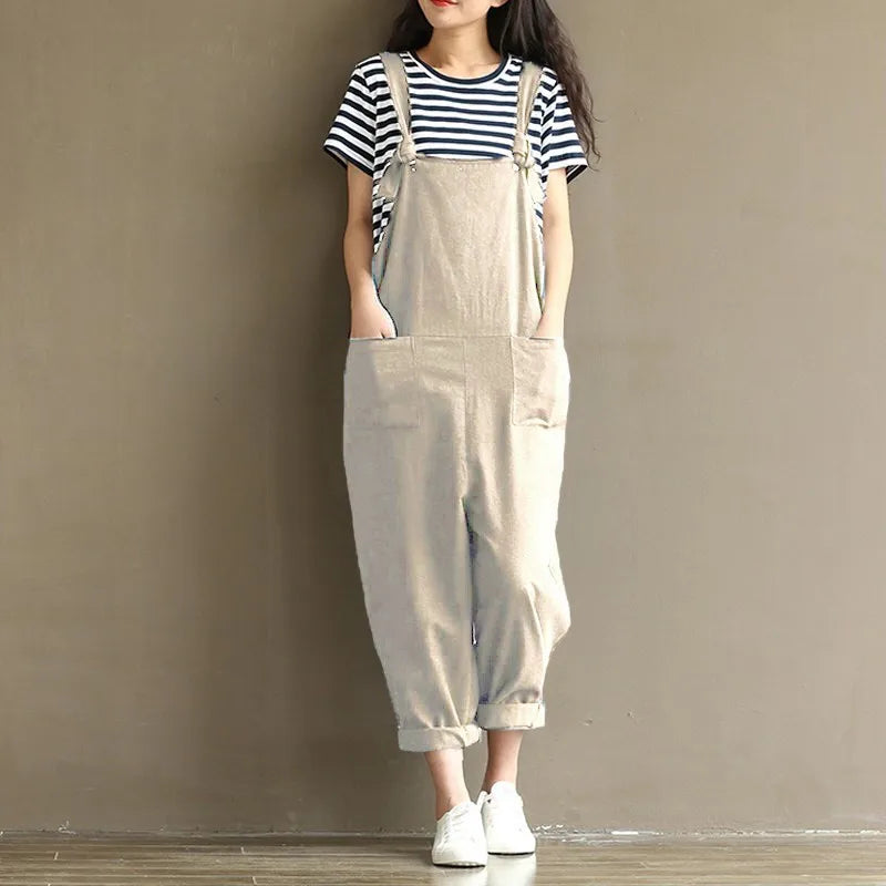 Beige linen overalls with pockets, paired with striped tee and white sneakers for cozy loungewear
