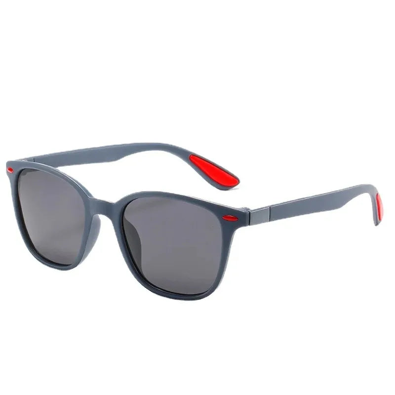 Gray sunglasses with red accents on temples, stylish unisex sunwear for casual comfort