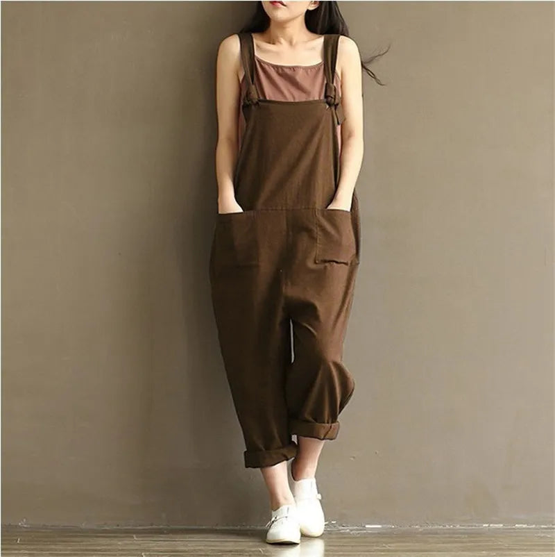 Brown linen overalls with rolled cuffs, paired with white sneakers for cozy loungewear style
