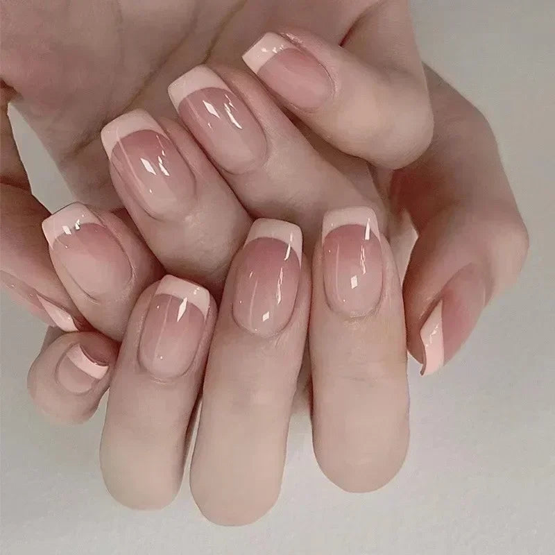 Natural pink French manicure with glossy nude finish, short square nails, minimalist nail art