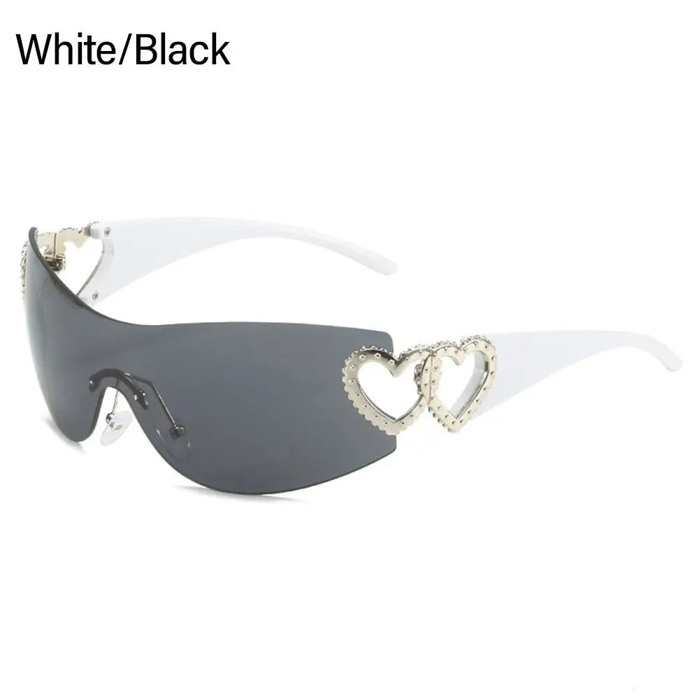 White and black heart-accented sunglasses with studded details, stylish and trendy eyewear