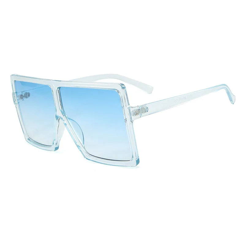 Oversized clear frame sunglasses with blue gradient lenses, stylish and modern accessory