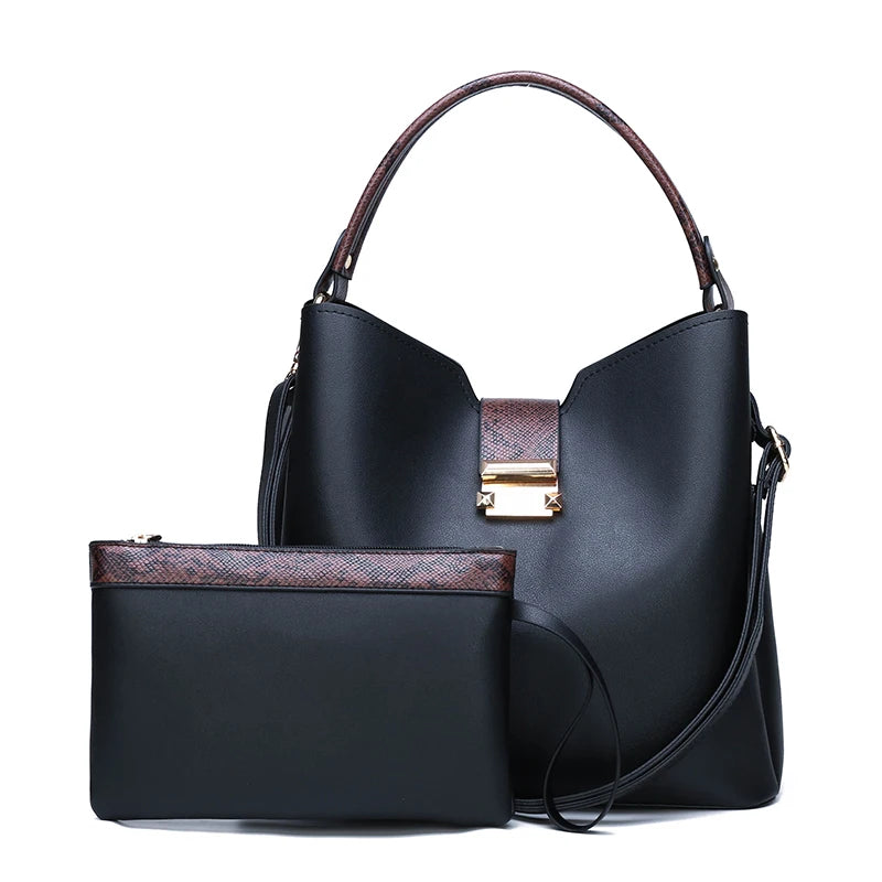 Concierge Tiers display: black handbag and matching pouch with brown accents and gold clasp